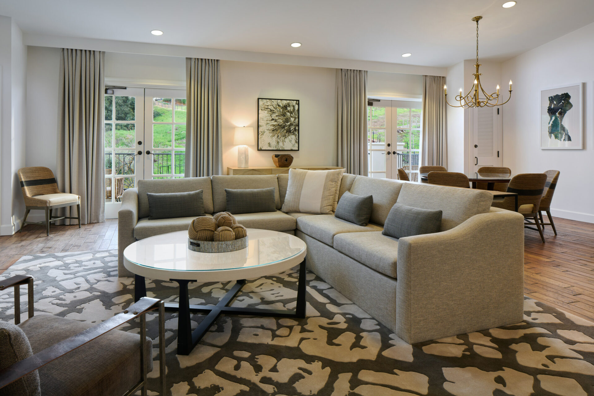 Sofas with a center table. A dining table is seen in the background.