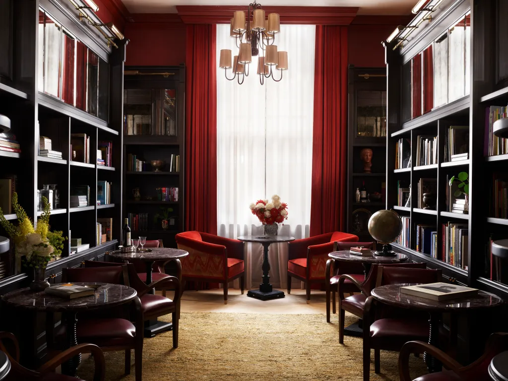 The library features various seating options, with book shelves on either side.