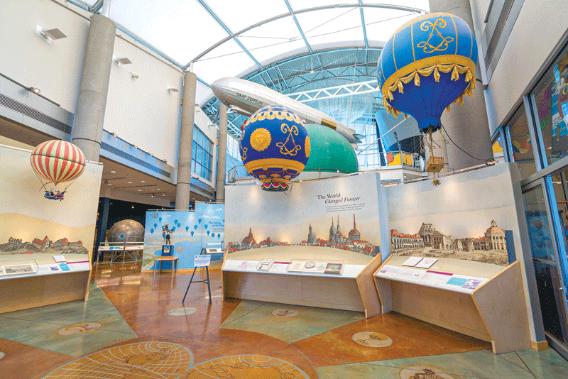 The inside of the museum with a few balloons on display.