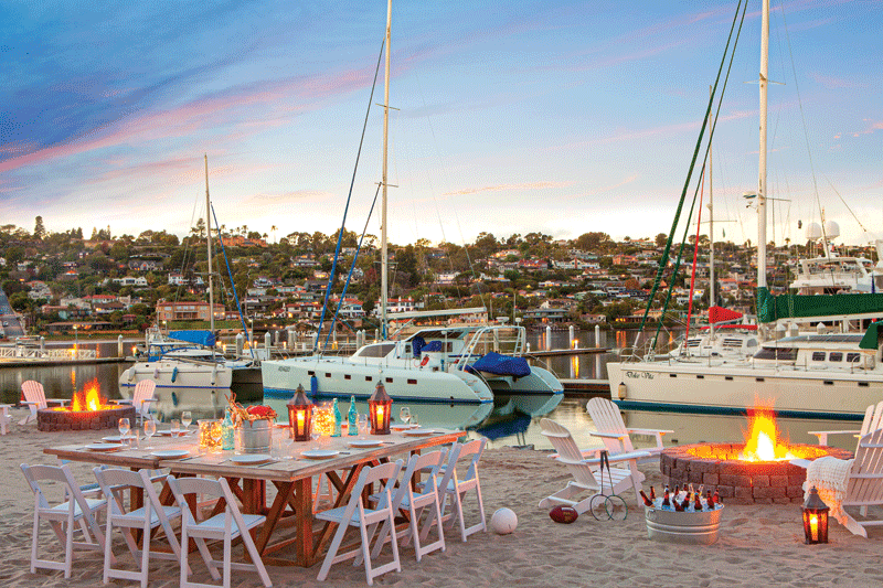 A view of a table and a boats in the background.