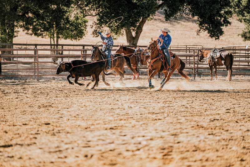 People ride horses at the ranch.