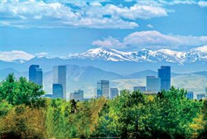 A view of the mountains in the background and the city ahead of it. 