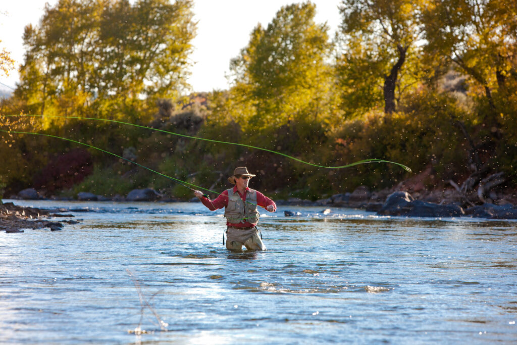 A person flyfishing. 