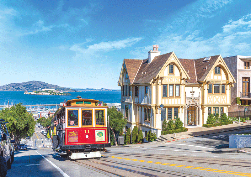 A cable car on the street.
