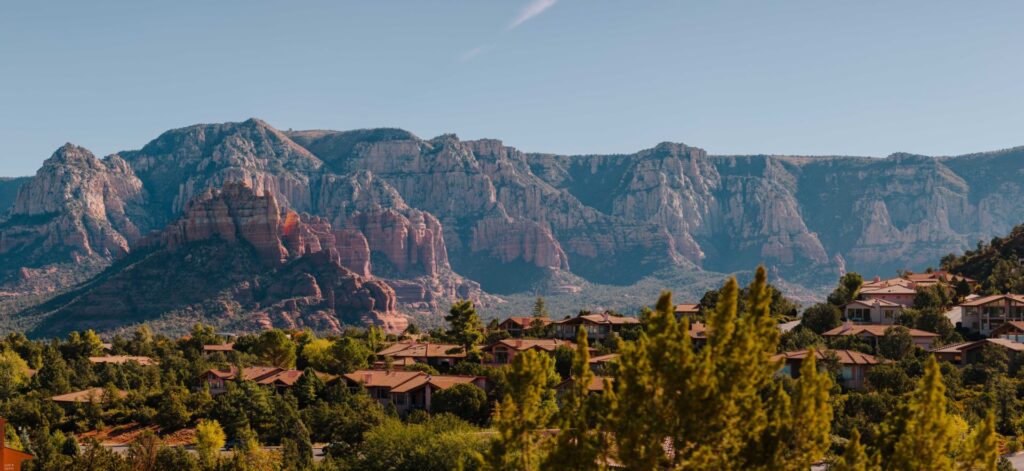 Sedona's red rock formations in the background.