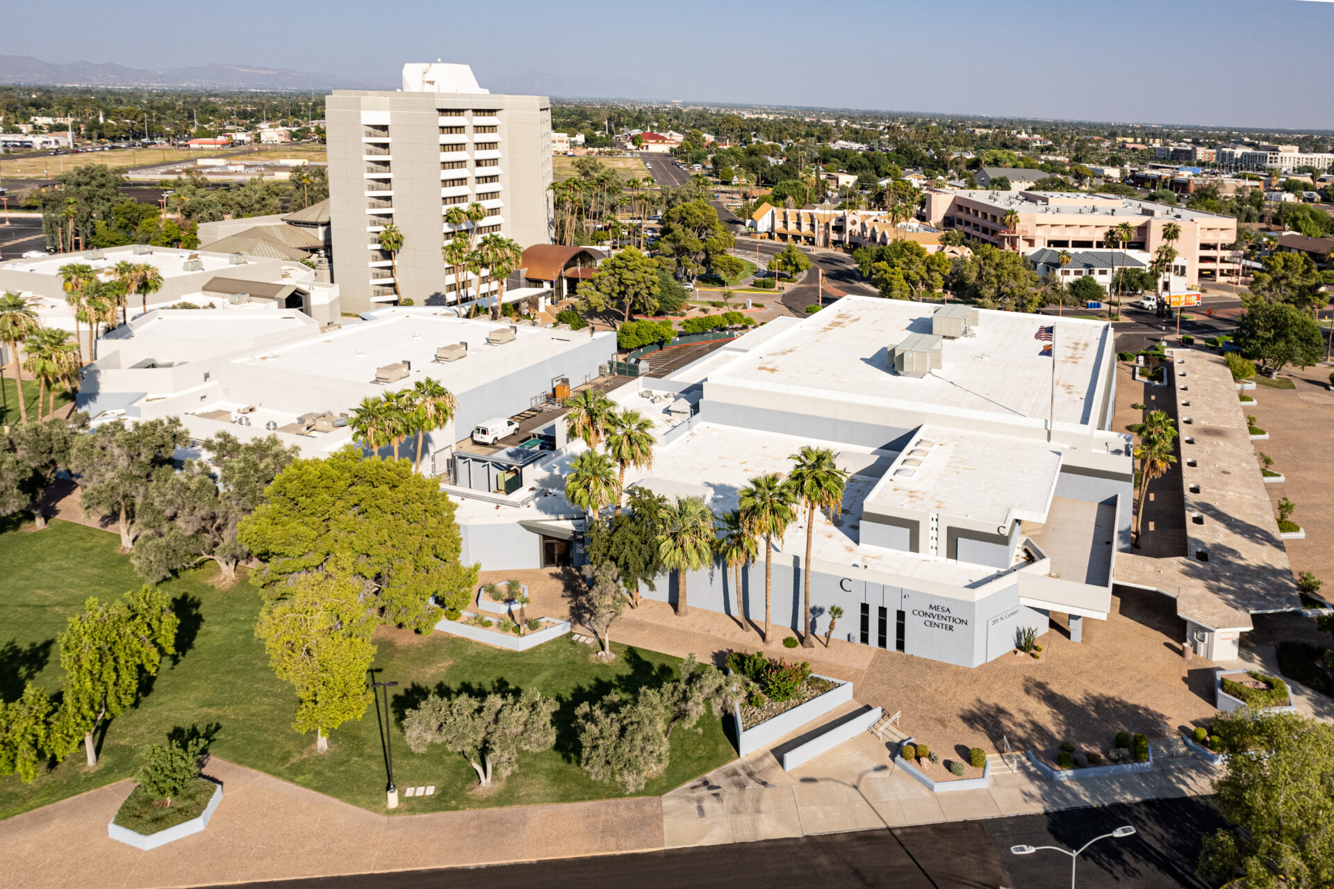 Exterior view of Mesa Amphitheatre in Mesa, Arizona, an outdoor venue with tiered seating and a stage used for concerts and community events.